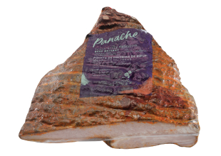 A large deli case-sized Panache Brisket in Texas Mesquite flavour, cryovac wrapped with the purple Panache label on the front.