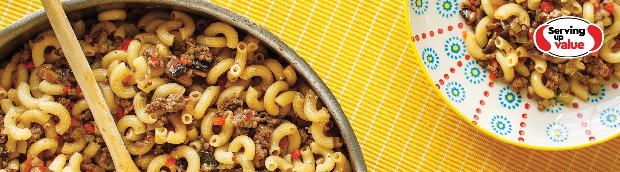 bowl of beef and macaroni on yellow placemat